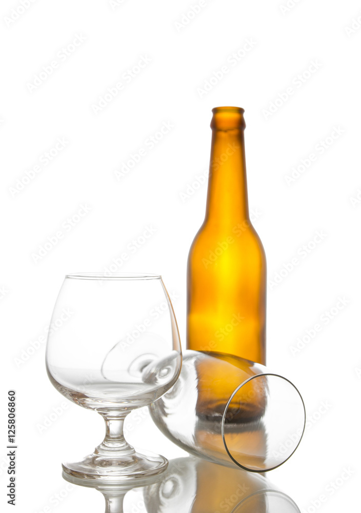 Empty beer bottle and glasses,shot on white isolated.. Empty beer bottle and glasses,shot on white isolated..