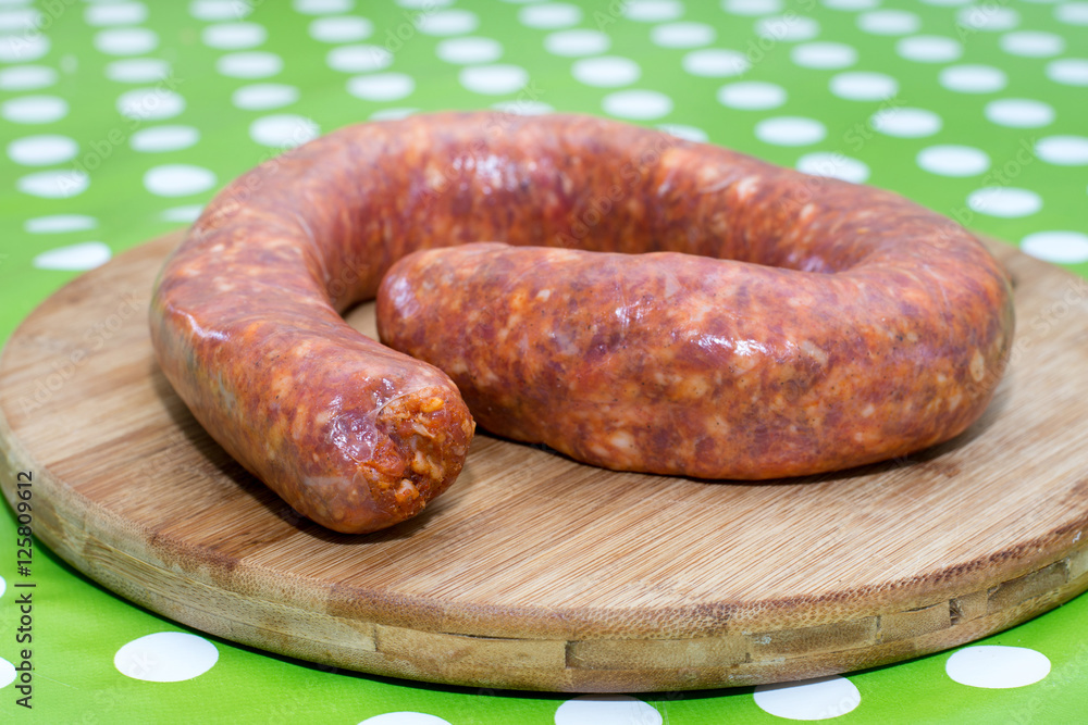 Fototapeta premium Domestic sausages on the cutting board