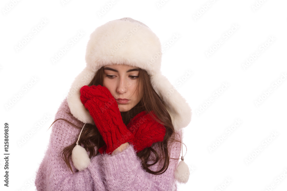 fun serious girl in winter clothes isolated on white background