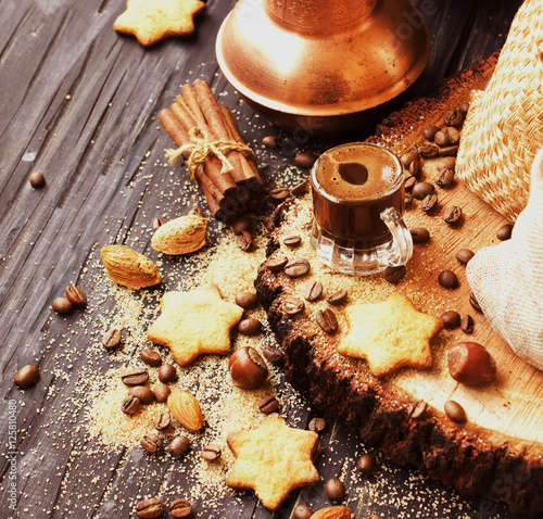 Turkish coffee in a small cup, cookies, selective focus photo