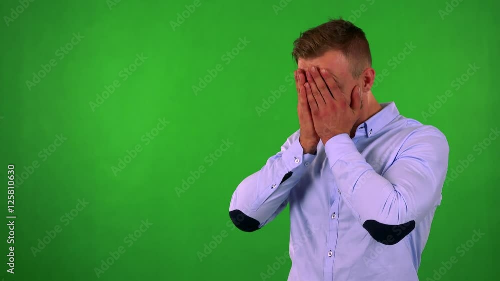 young handsome business man cries - green screen - studio young handsome business man cries - green screen - studio