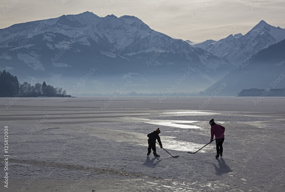 Hockey family on the frozen Zell lake