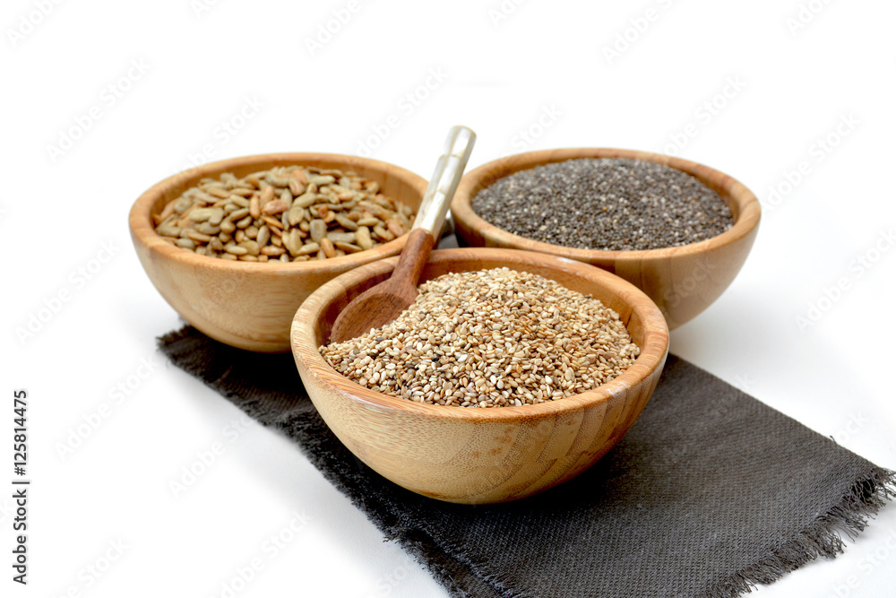 Wooden bowl filled with seeds of Sesame Wooden bowl filled with seeds of Sesame