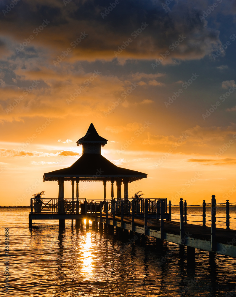 gazebo bridge sea at sunset