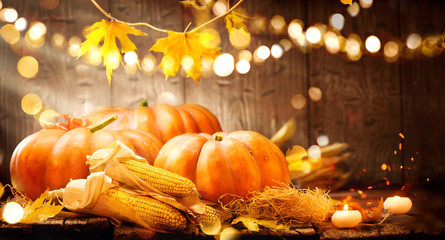 Thanksgiving Day. Autumn Thanksgiving pumpkins over wooden background