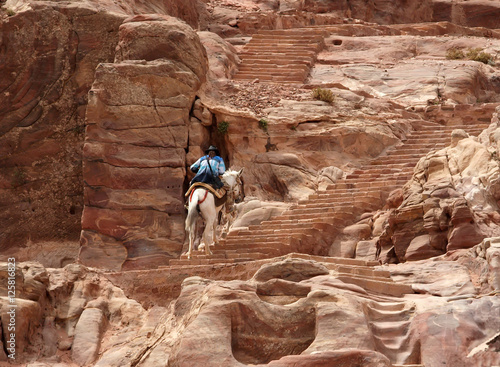 climbing on horseback. canyon