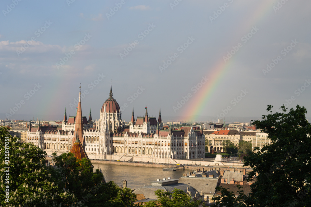 Rainbow over Parlament in Budapest with riverside in Hungary