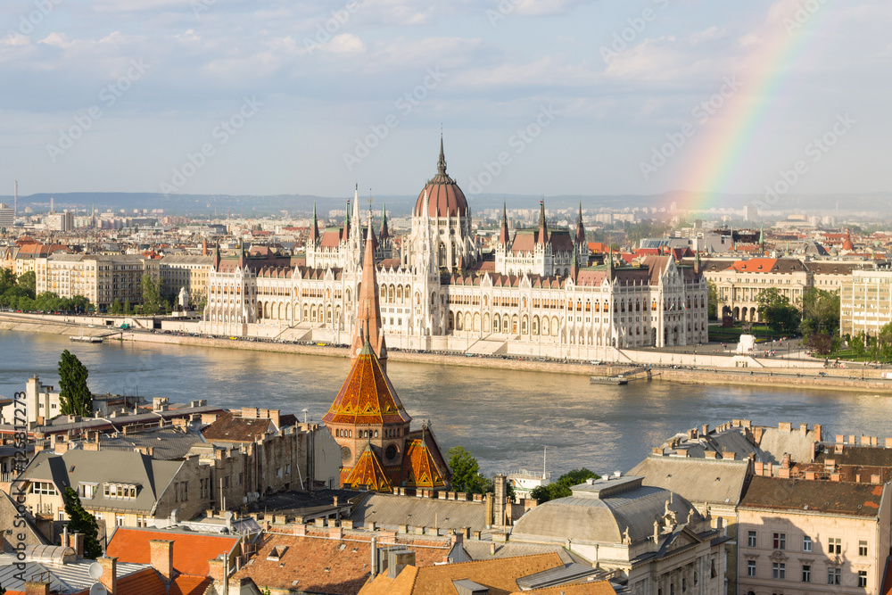 Rainbow over Parlament in Budapest with riverside in Hungary