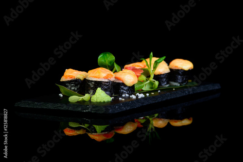 grilled roll on a black background with reflection
