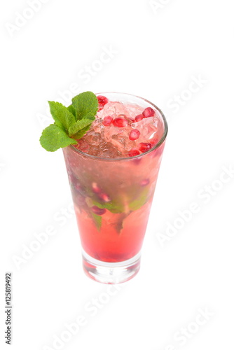 drink with pomegranate seeds and mint ice on white background