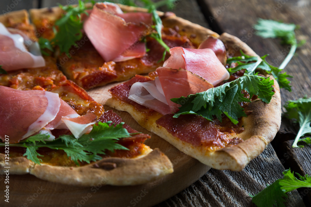 Pizza with prosciutto and arugula Pizza with prosciutto and arugula