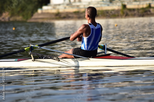 Scull rowing team training. Athletic water sport.