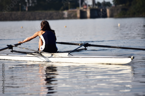 Scull rowing team training. Athletic water sport. photo