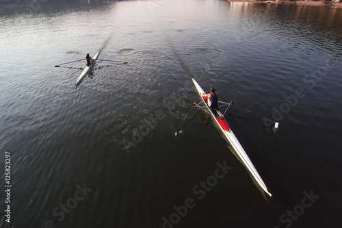Canoe kayak Scull rowing team training. Aerial view,  photo