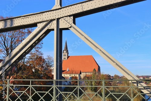 The collegiate church Maria Himmelfahrt in Laufen, Bavaria, Germany, seen from the Salzach brige.