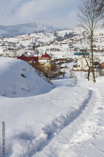 winter village landscape in Carpathian mountains © photo_superteam