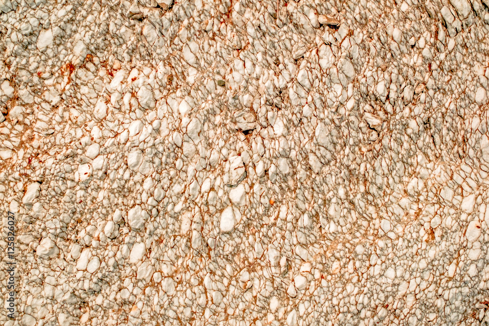 Natural white rock with orange veins. Natural white rock with orange veins.