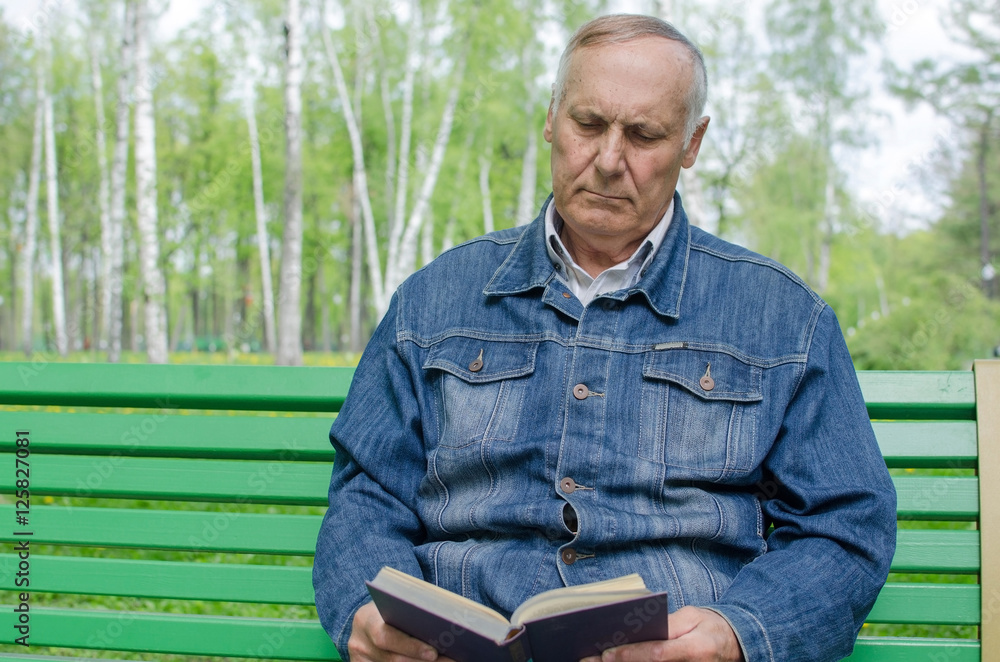 Aged man is reding the book Aged man is reding the book