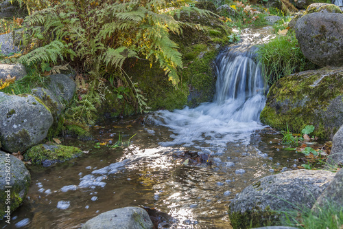 Small Autumn Waterfall in a City Park