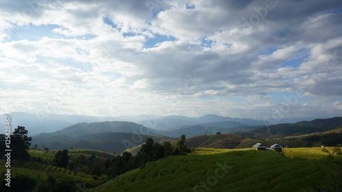 Movement of light over the Rice fields on terraced at Mae Cham, Chiang Mai, Thailand. Beautiful scene of famous terrace rice field in Thailand. Harvesting season.