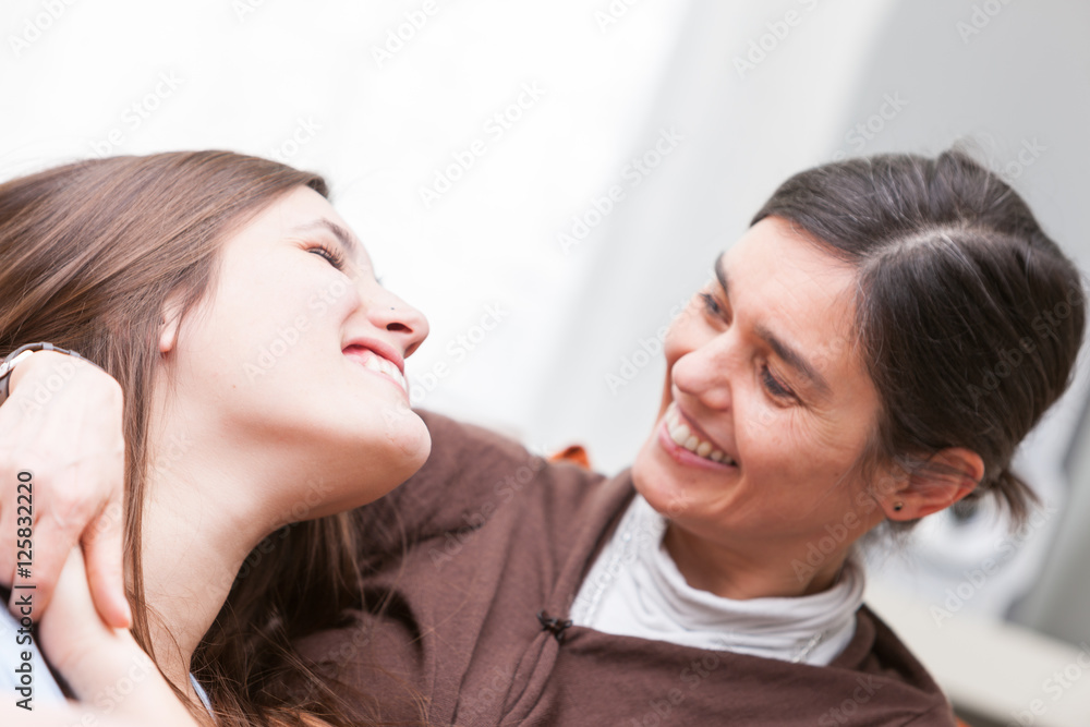 Happy Mom and daughter relaxing together Happy Mom and daughter relaxing together