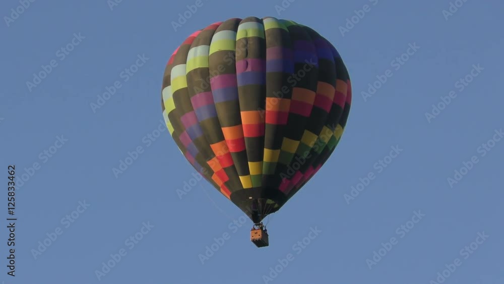 Colorful hot air balloon against blue sky Colorful hot air balloon against blue sky