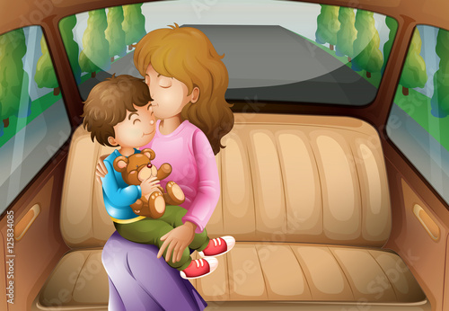 Boy and mother in back seat