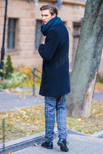 Stylish young man waiting at the street