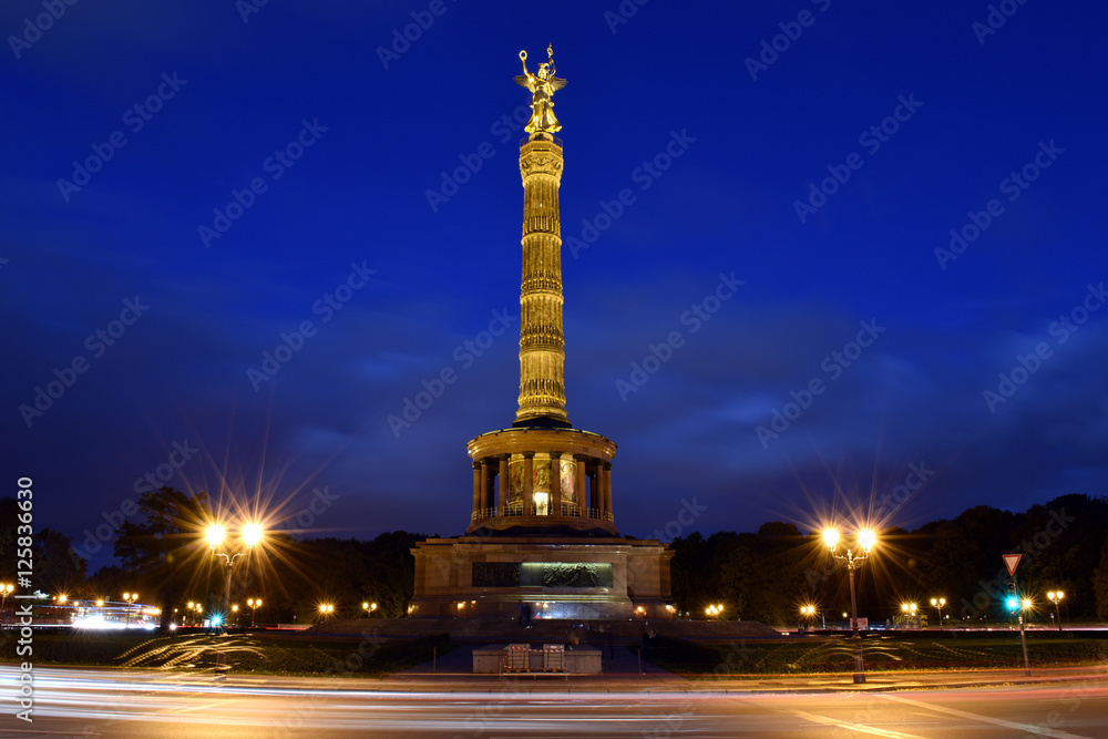 Victory column in the center of Berlin, Germany, view during sunset and traffic rush hour