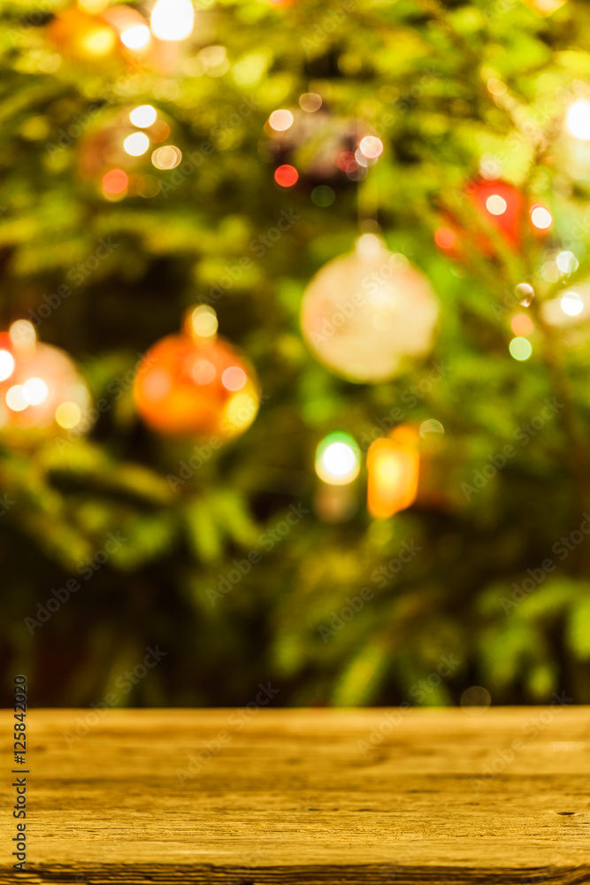 Decorated and illuminated Christmas tree on indistinct, blurred and  fairytale background.
