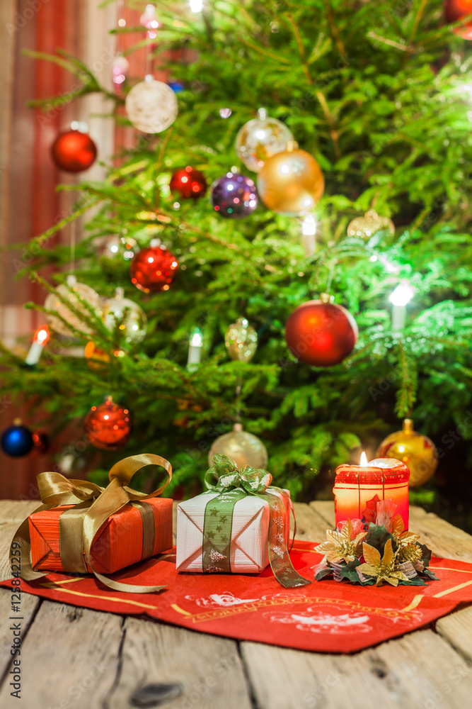Decorated and illuminated Christmas tree on indistinct, blurred and fairytale background.
Decorated and illuminated Christmas tree on indistinct, blurred and fairytale background.