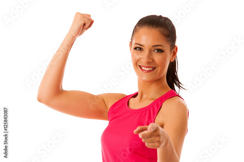 Woman rises arm as gesture of power and success isolated over wh