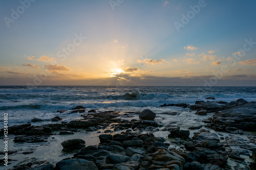 Sundown in Cape Town, South Africa with splashing waves © Benjamin