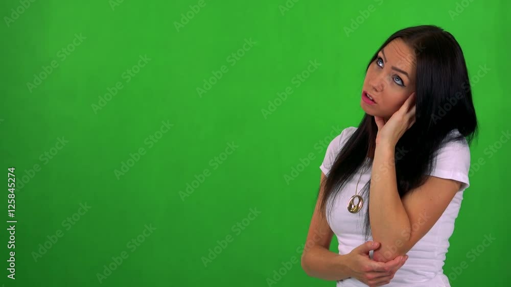 young pretty woman is bored - green screen - studio young pretty woman is bored - green screen - studio
