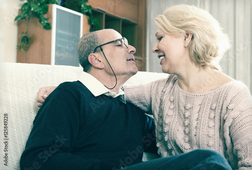 Wallpaper Mural Couple pensioners together on sofa at home Torontodigital.ca