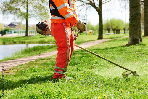 lawn mower worker man cutting grass