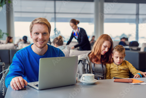 Smiling family with child at airport © Yakobchuk Olena