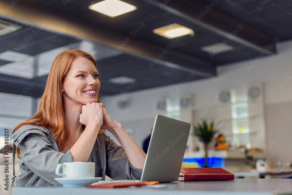 Beautiful girl using laptop in airport Beautiful girl using laptop in airport