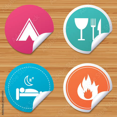 Round stickers or website banners. Food, sleep, camping tent and fire icons. Knife, fork and wineglass. Hotel or bed and breakfast. Road signs. Circle badges with bended corner. Vector
