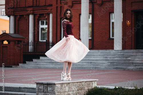 portrait pretty girl with pink fluttering dress. vintage