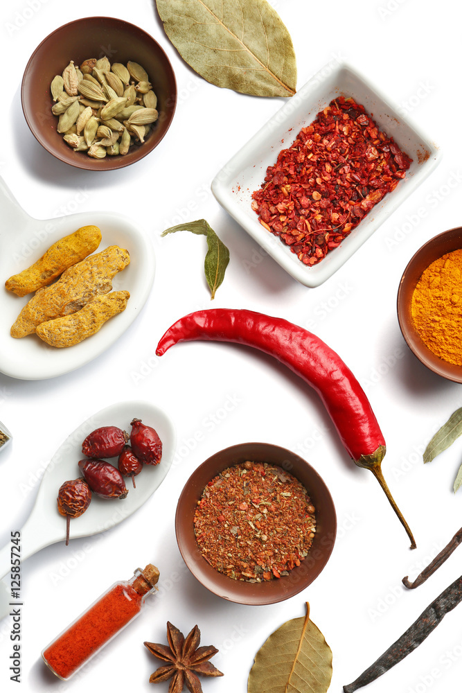 Flat lay of assorted herbs and spices on white background Flat lay of assorted herbs and spices on white background
