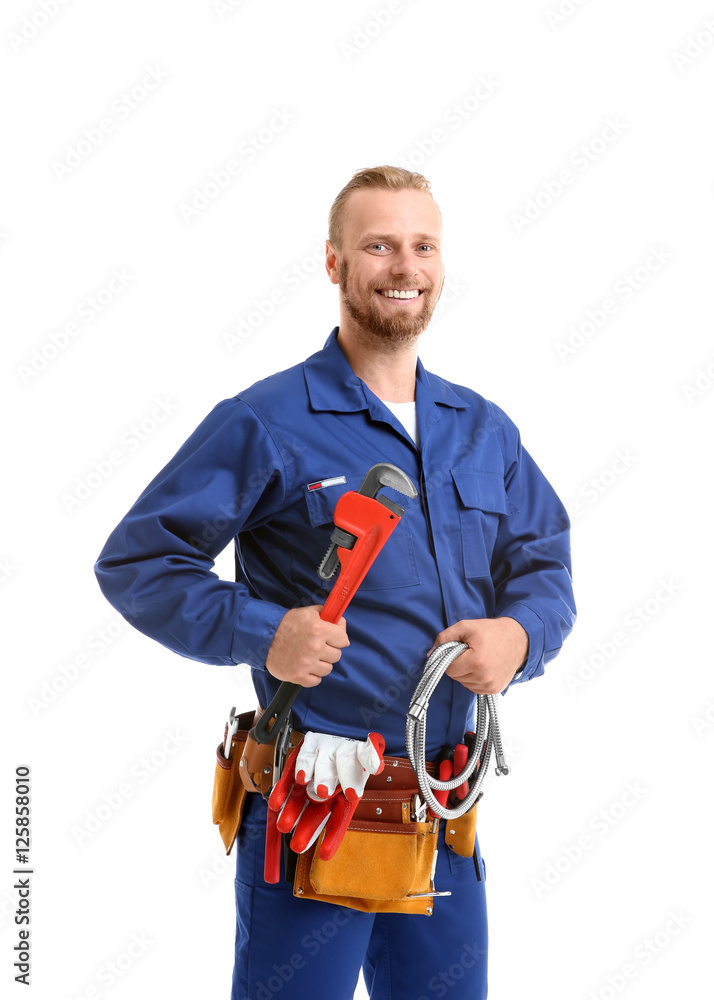 Handsome plumber with pipe wrench and flexible hose isolated on white Handsome plumber with pipe wrench and flexible hose isolated on white