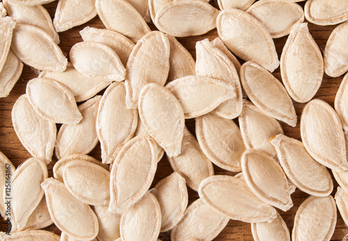 Pumpkin seeds on wood board