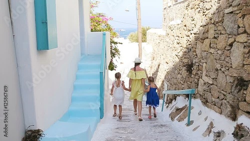 Family vacation in Europe. Mother and little girl in european vacation in greek town