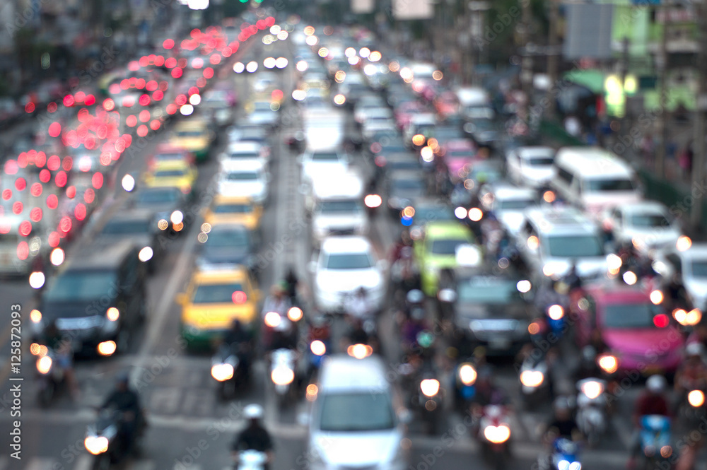 Blurred background of traffic jam, cars struck,motorcycle in traffic, Len flares effect.