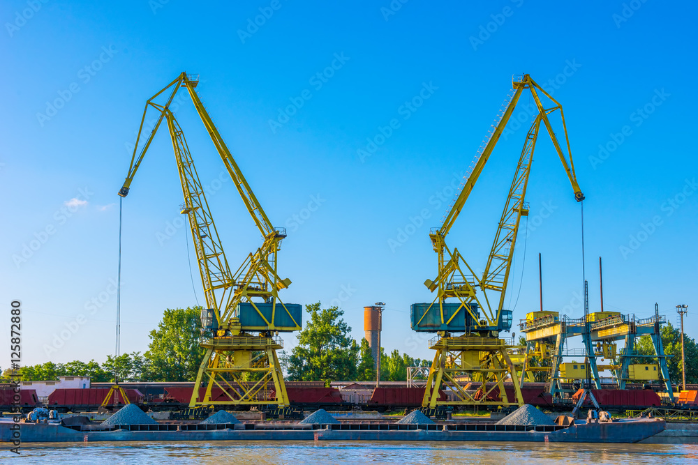Two cranes on a naval port