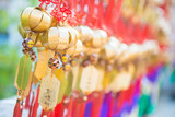 Golden bell at Wong Tai Sin Temple people wish and hang it on ro
