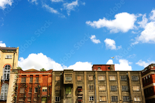 Abandoned building with blue and sunny sky photo