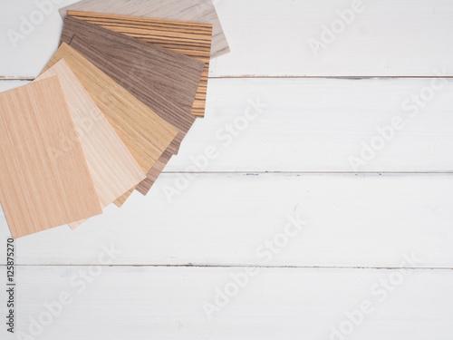 samples of veneer wood on white wood background