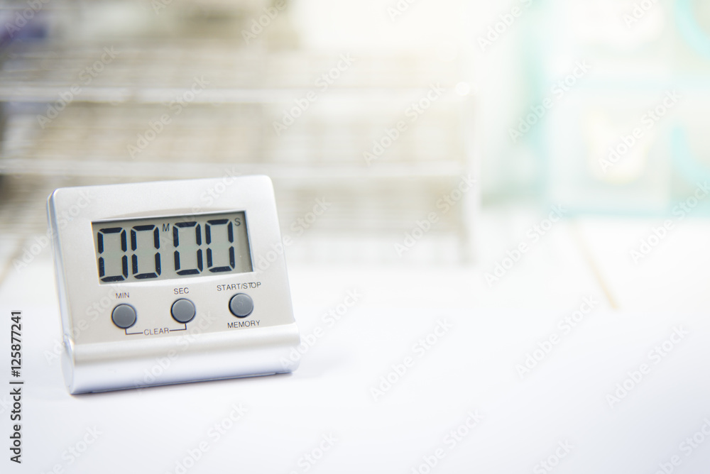 Timer count down laboratory equipment in over white tone. Timer count down laboratory equipment in over white tone.